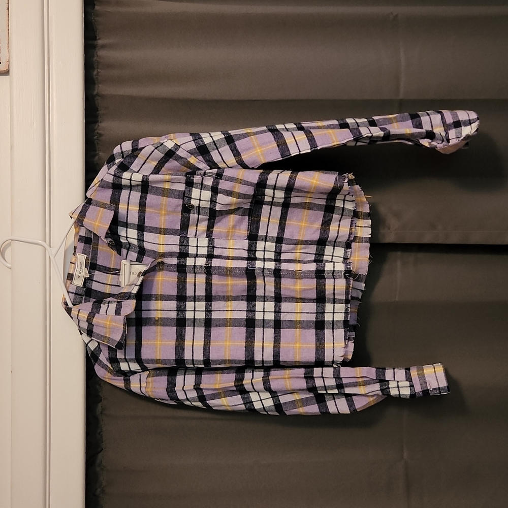 Small, purple flannel top with black, yellow, and white.
